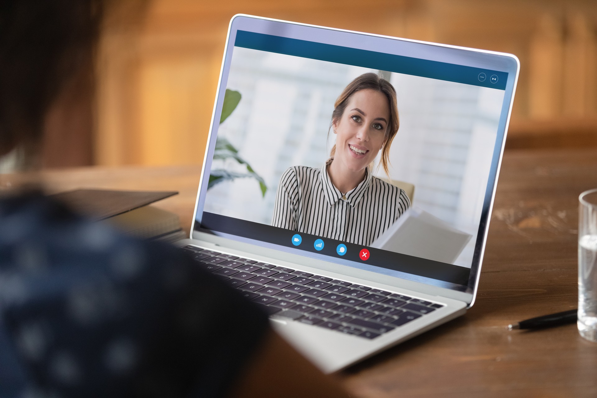 Close up businesswoman making video call, discussing project with colleague